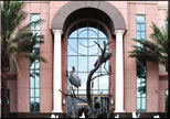 Statue of herons in a fountain outside a building